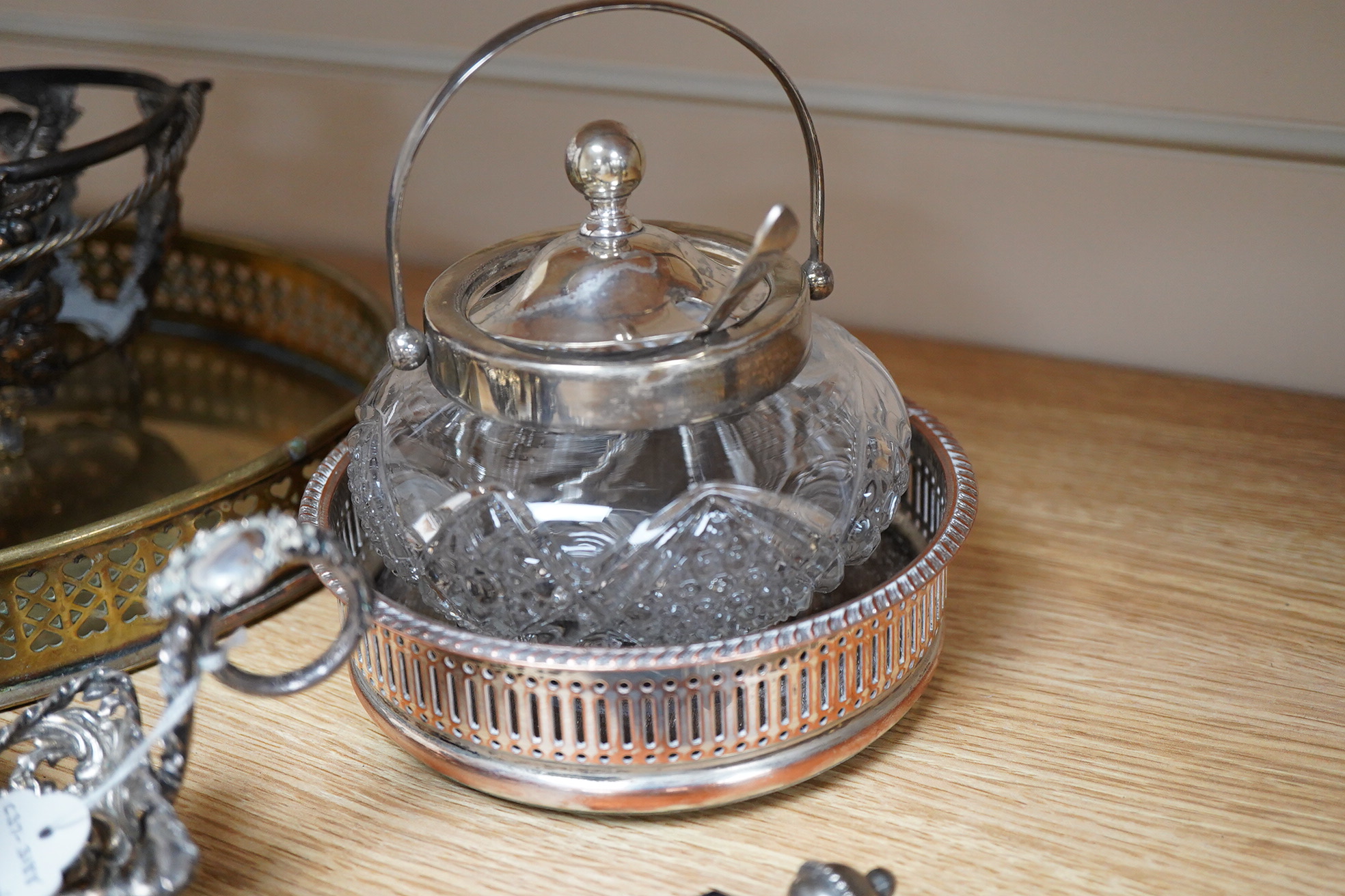 An Art Nouveau style enamelled timepiece by A. E. Williams, a small group of various plated wares and some small silver